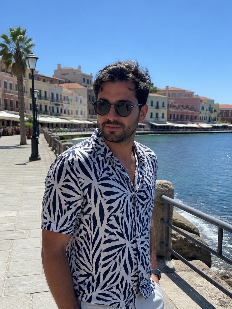 AI Twin example: Printed shirt and sunglasses on a seaside promenade.
